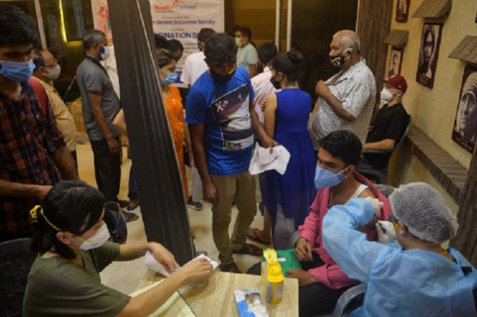 india_vaksin_86_juta_warga_sehari