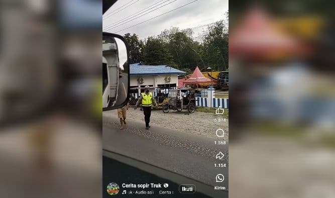 viral_polisi_di_asahan_tilang_truk_saat_berhenti_di_lampu_lalu_lintas