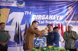 bupati_fery_sahputra_ucapkan_selamat_hut_ke14_partai_nasdem_konsistensi_membawa_perubahan_untuk_labusel