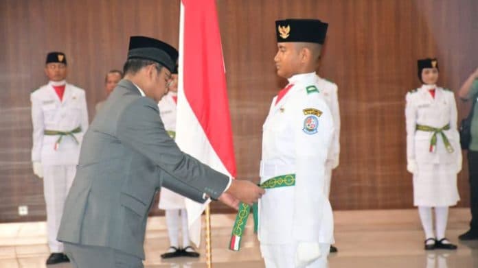 45_anggota_paskibraka_deli_serdang_dikukuhkan_paskibraka_putri_tetap_pakai_jilbab