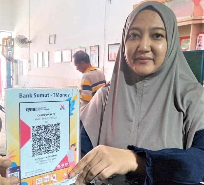 gunakan_pembayaran_qris_pengusaha_bengkel_sepeda_motor_punya_kisah_tersendiri