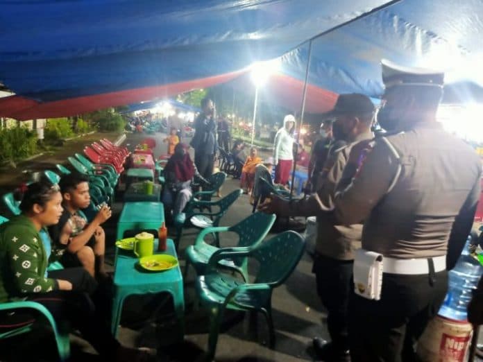 jelang_nataru_polres_siantar_ingatkan_warga_bahaya_covid_19