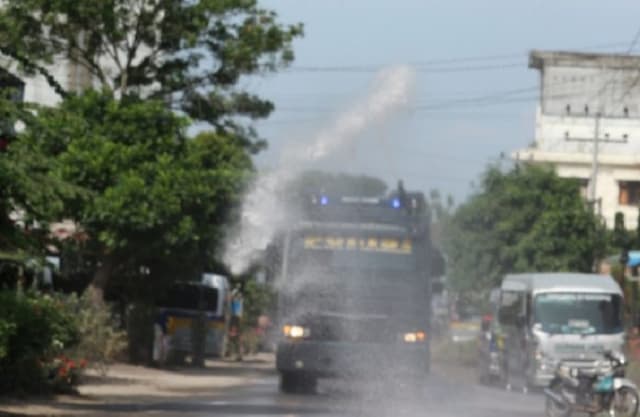 kapolres_simalungun_pimpin_penyemprotan_disinfektan_di_kota_perdagangan