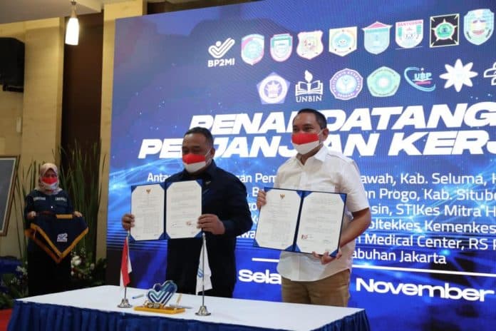 lindungi_pekerja_migran_bupati_pakpak_bharat_teken_kerja_sama_dengan_bp2mi