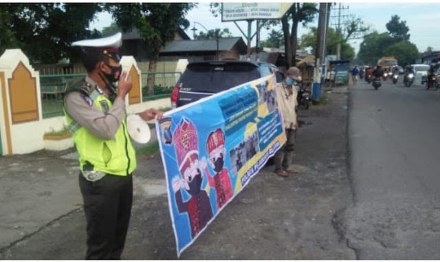 polres_pelabuhan_belawan_imbau_warga_terapkan_protokol_kesehatan