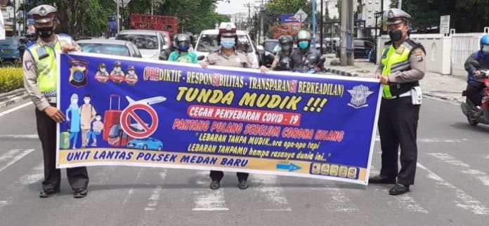 polsek_medan_baru_ajak_warga_perantauan_tunda_mudik