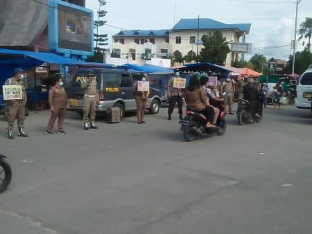 puluhan_warga_terjaring_tak_pakai_masker_di_toba