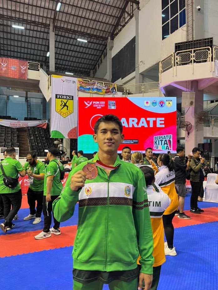 reza_mahendra_karateka_debutan_sumut_bersyukur_raih_perunggu_di_pon_xxi
