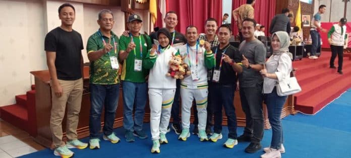 taekwondo_tambah_emas_sumut_duduk_di_4_besar_klasemen_sementara_peparnas_solo