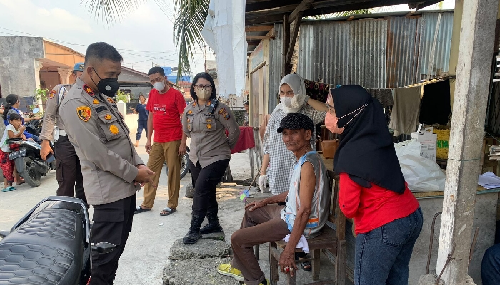 targetkan_herd_immunity_polsek_medan_baru_gelar_vaksinasi_door_to_door