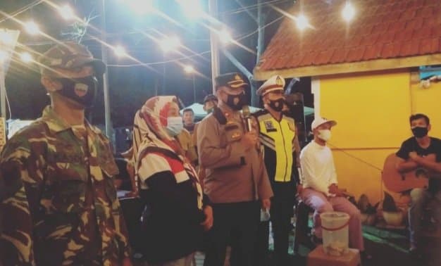 waka_polres_pelabuhan_imbau_warga_belawan_patuhi_prokes