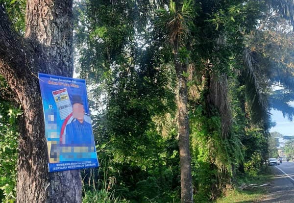 walhi_sumut_soroti_pemasangan_apk_caleg_di_pepohonan_tepi_jalan