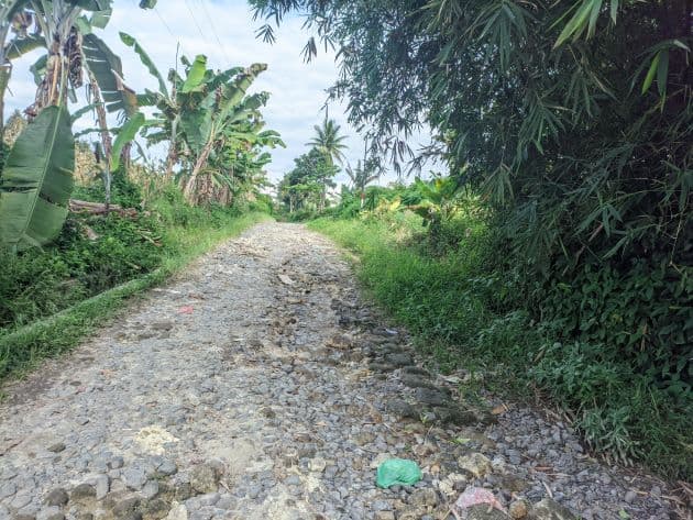 warga_minta_pembangunan_jalan_di_nagori_bahal_gajah_dilanjutkan