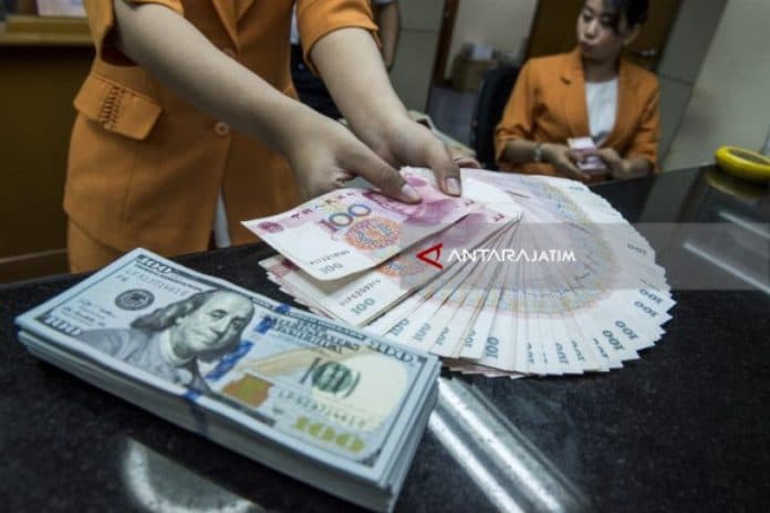 yuan_china_menguat_99_poin_jadi_70690_terhadap_dolar_as